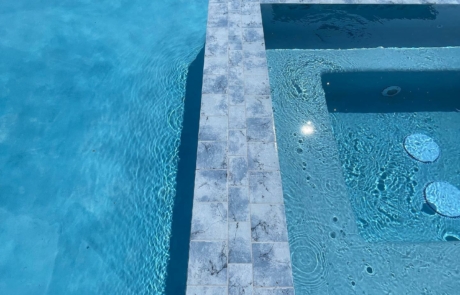 Finest Finish Sparkle Quartz Lakeside spa with tiled edge detail in blue